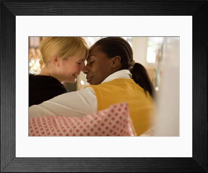 Framed Print : Lesbian couple sitting with their foreheads together Framed Print : Lesbian couple sitting with their foreheads together