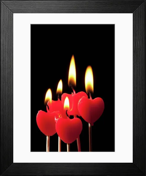 Framed Print : Five lit heart shaped candles on sticks arranged in a group Framed Print : Five lit heart shaped candles on sticks arranged in a group