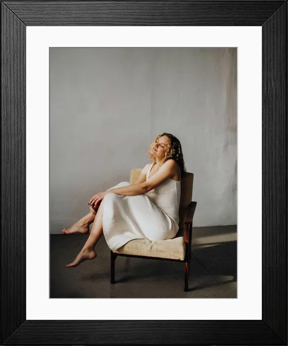 Framed Print : woman in white dress in armchair Framed Print : woman in white dress in armchair