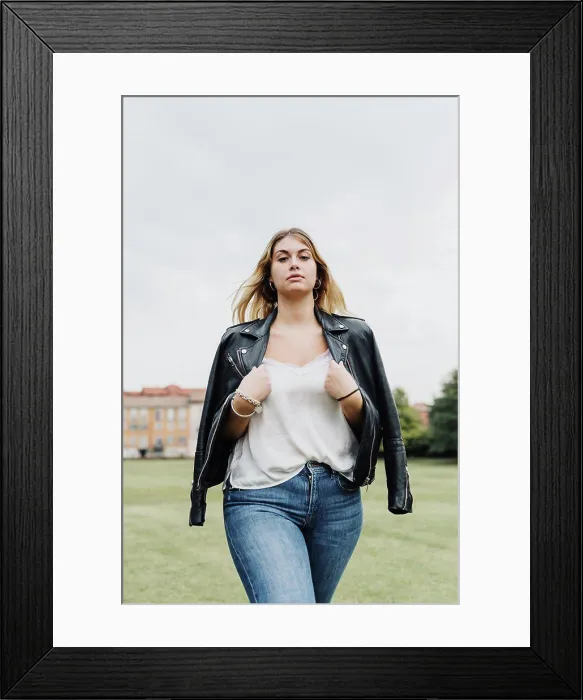 Framed Print : Portrait of confident young woman in park Framed Print : Portrait of confident young woman in park