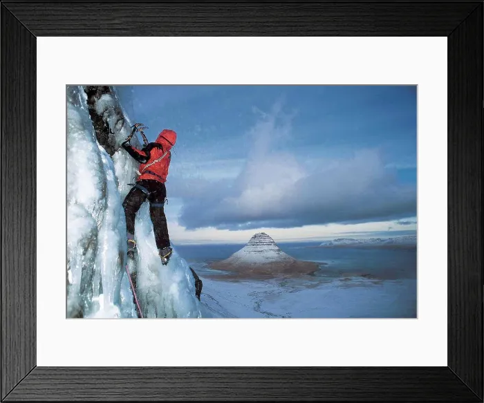 Framed Print : man climbs frozen waterfall above Grundafjordur fjord in Iceland Framed Print : man climbs frozen waterfall above Grundafjordur fjord in Iceland