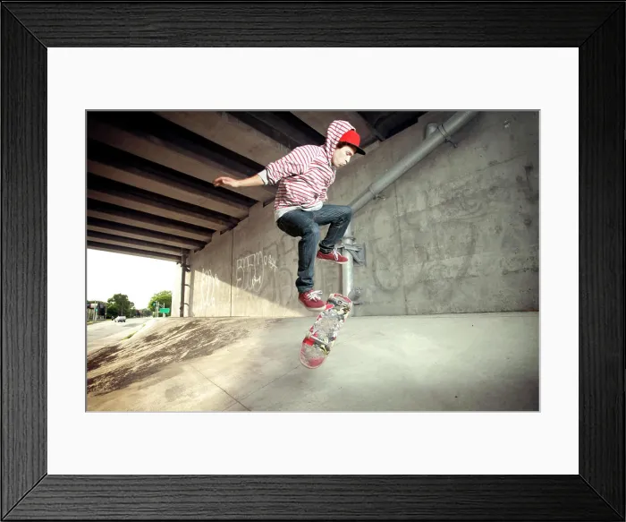 Framed Print : Young male skateboarding under overpass Framed Print : Young male skateboarding under overpass
