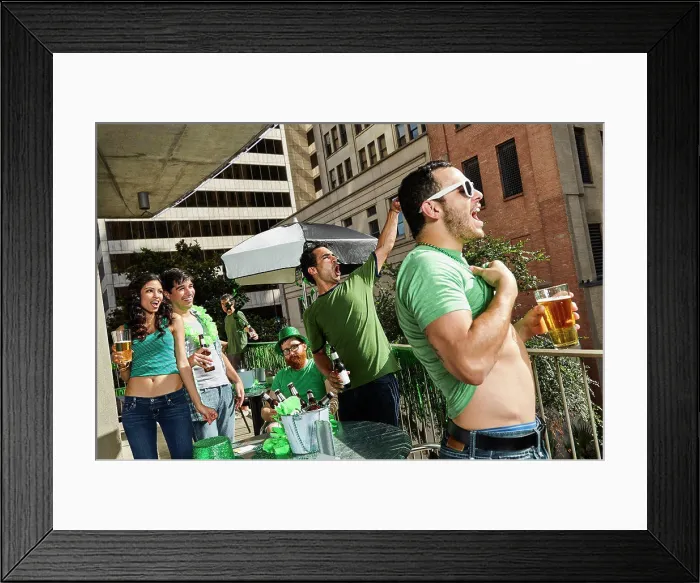 Framed Print : Group of friends hanging out on balcony of bar enjoying the St Patrick's Day festivities Framed Print : Group of friends hanging out on balcony of bar enjoying the St Patrick's Day festivities