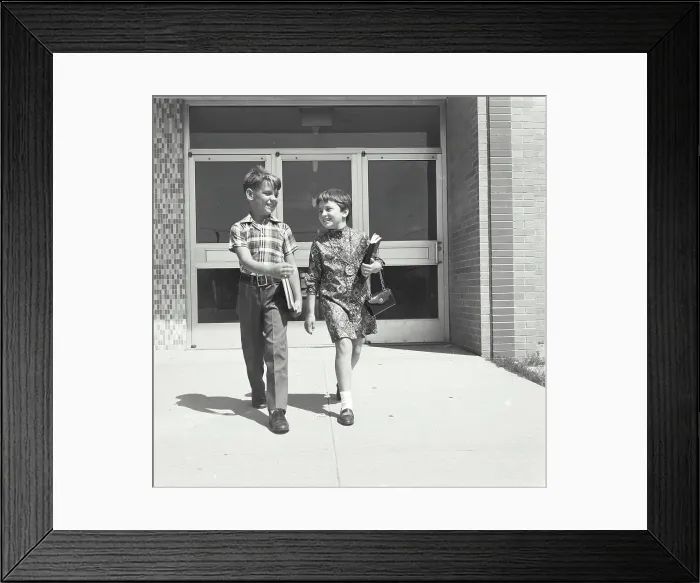 Framed Print : Boy and girl walking together