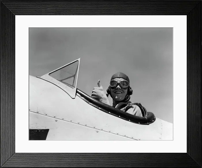 Framed Print : 1940S Smiling Army Air Corps Pilot In Open Cockpit Wearing A Leather Flying Helmet Giving A Thumbs-Up Sign Framed Print : 1940S Smiling Army Air Corps Pilot In Open Cockpit Wearing A Leather Flying Helmet Giving A Thumbs-Up Sign