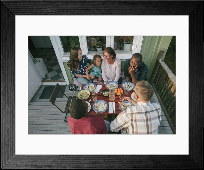 Framed Print : High angle view of multi-generation family having lunch at table on porch