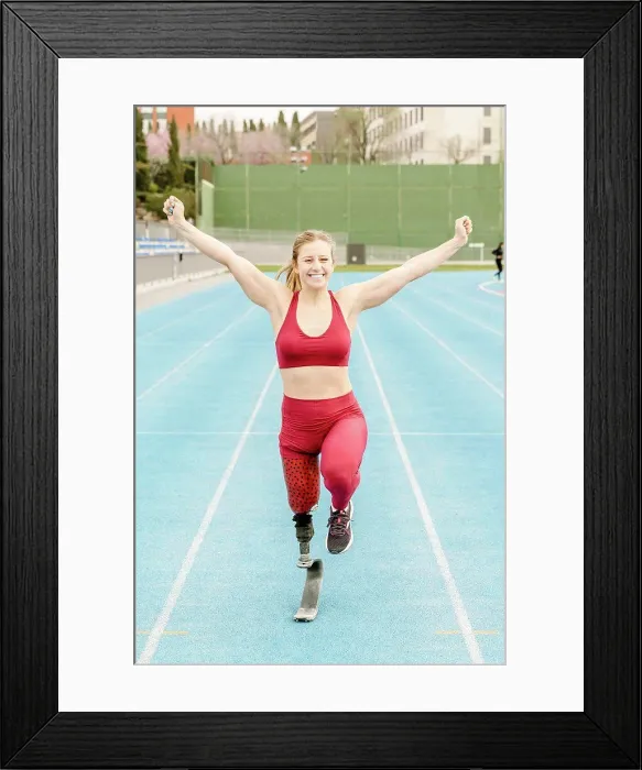 Framed Print : Handicapped race winner running on track