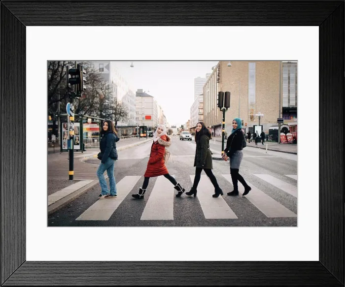 Framed Print : Full length of happy female friends crossing street in city Framed Print : Full length of happy female friends crossing street in city