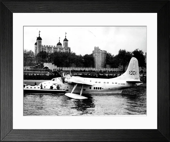 Framed Print : Flying Boat Moored on Thames. Moored at Tower Pier with the Tower of London in the background