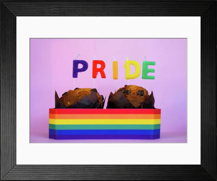 Framed Print : Two muffins with candles and Pride flag Framed Print : Two muffins with candles and Pride flag