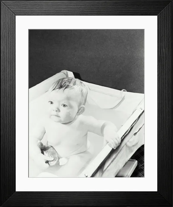 Framed Print : High angle view of a baby in a bathtub