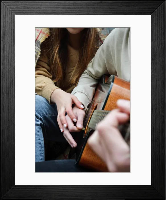 Framed Print : the hands of a girl and a boy on a guitar Framed Print : the hands of a girl and a boy on a guitar