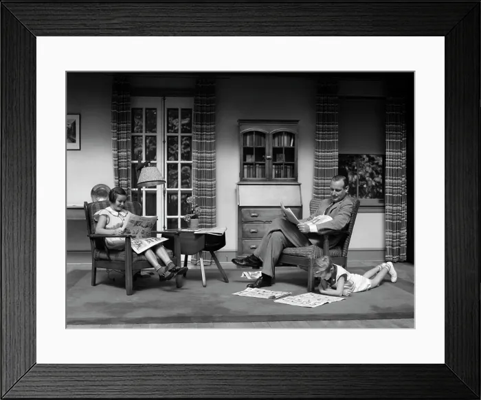 Framed Print : 1930S Man Father Reading Newspaper Boy Girl Reading Comics In Living Room Framed Print : 1930S Man Father Reading Newspaper Boy Girl Reading Comics In Living Room
