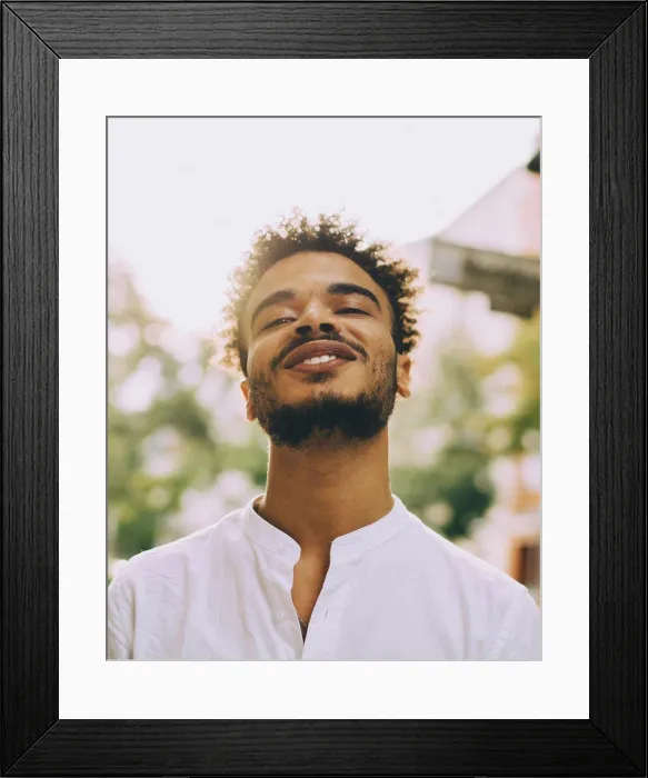 Framed Print : Portrait of smiling young man in casuals during sunny day Framed Print : Portrait of smiling young man in casuals during sunny day
