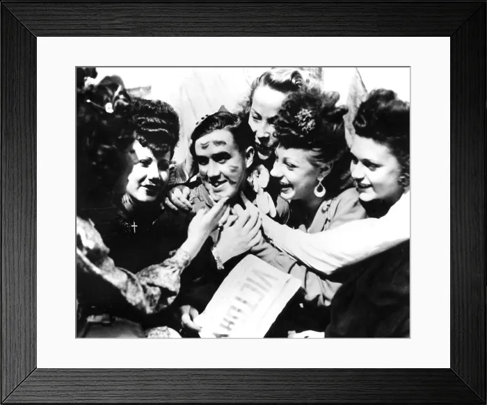 Framed Print : VE Day celebrations, Paris, 8 May 1945. A soldier smothered with kisses by jubilant women. The photographer is unknown Framed Print : VE Day celebrations, Paris, 8 May 1945. A soldier smothered with kisses by jubilant women. The photographer is unknown