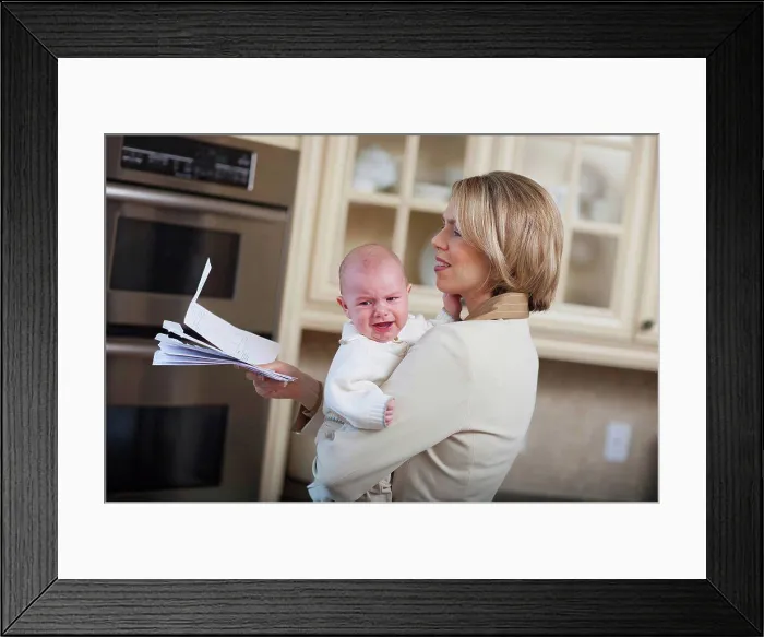 Framed Print : mother with baby stressing over household bills, jordan ontario canada Framed Print : mother with baby stressing over household bills, jordan ontario canada