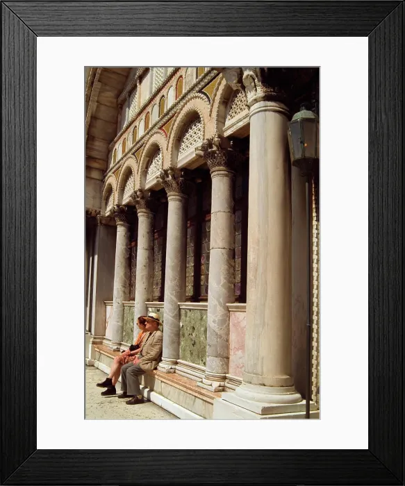 Framed Print : Italy, Venice, Couple sitting on ledge of St. Mark's Basilica Framed Print : Italy, Venice, Couple sitting on ledge of St. Mark's Basilica