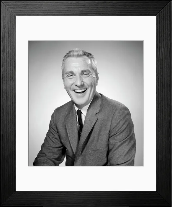 Framed Print : Studio portrait of businessman laughing Framed Print : Studio portrait of businessman laughing