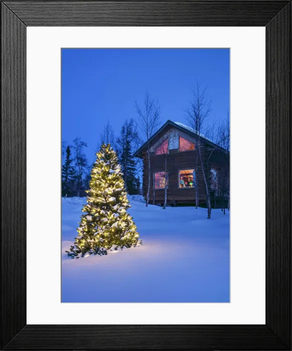 Framed Print : A Christmas tree with white lights outside a remote cabin Framed Print : A Christmas tree with white lights outside a remote cabin