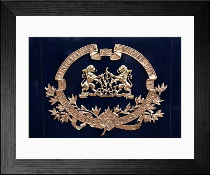 Framed Print : Brass crest on the side of a Venice Simplon Orient Express train carriage, heading to Venice, Italy