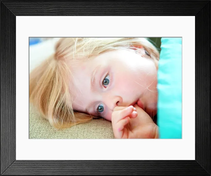 Framed Print : 5 years old girl sucking her thumb Framed Print : 5 years old girl sucking her thumb