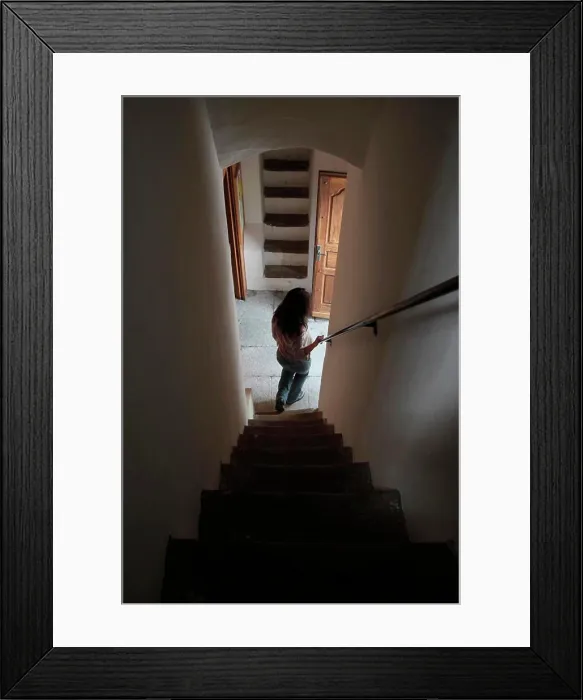 Framed Print : Woman walking down a staircase. Cordon. France Framed Print : Woman walking down a staircase. Cordon. France