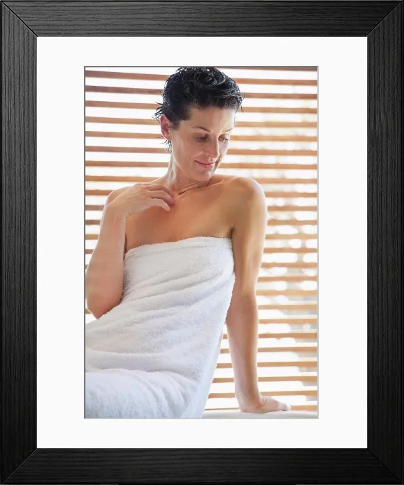Framed Print : Woman wrapped in a towel in bathroom Framed Print : Woman wrapped in a towel in bathroom