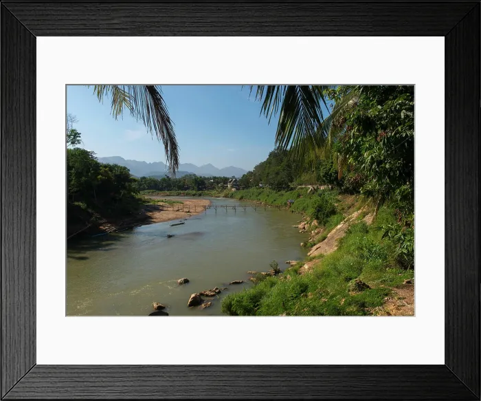 Framed Print : View of a bamboo bridge over the Nam Khan River in Luang Prabang in Central Laos Framed Print : View of a bamboo bridge over the Nam Khan River in Luang Prabang in Central Laos