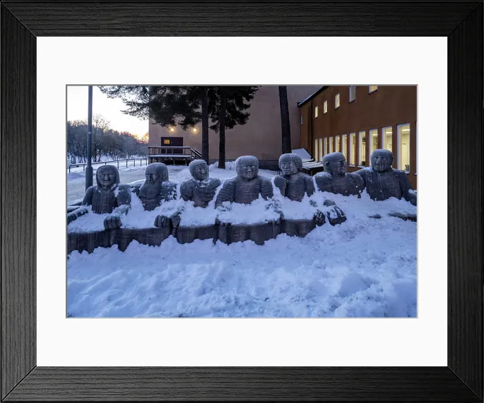 Framed Print : Stockholm, Sweden Exterior limestone statues of world figures at the Vastertorp sports facility in the snow