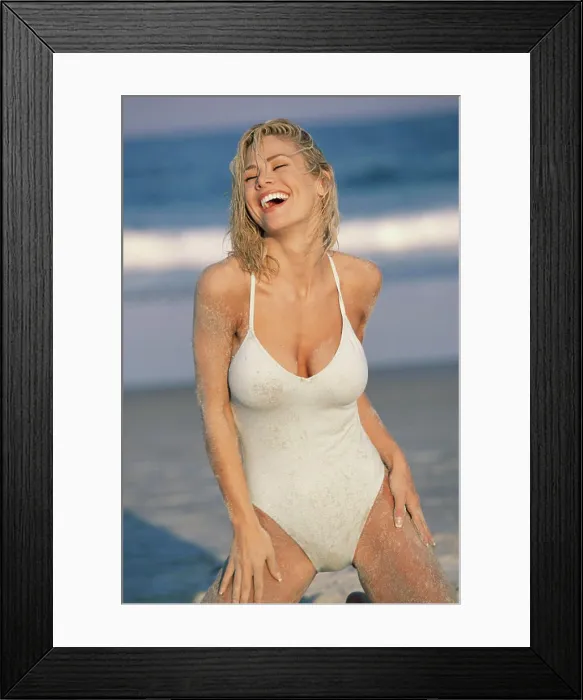 Framed Print : Young woman kneeling on the beach Framed Print : Young woman kneeling on the beach