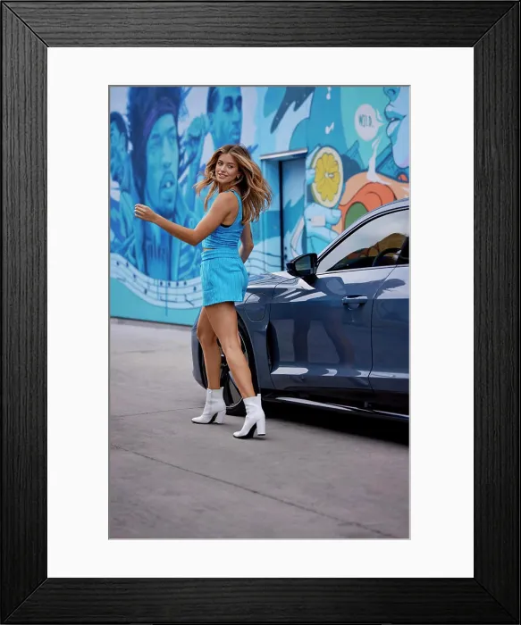 Framed Print : Fashionable woman in a blue dress and white boots posing by a car with colorful street art in the background Framed Print : Fashionable woman in a blue dress and white boots posing by a car with colorful street art in the background