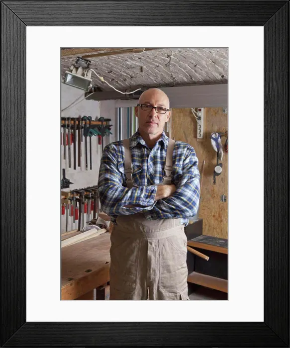 Framed Print : Mature man standing in carpenter shop, portrait Framed Print : Mature man standing in carpenter shop, portrait