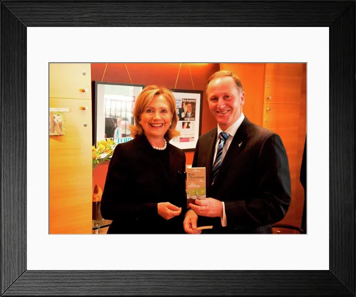 Framed Print : New Zealand Prime Minister John Key displays a Kiwi Chocolava bar beside U Framed Print : New Zealand Prime Minister John Key displays a Kiwi Chocolava bar beside U