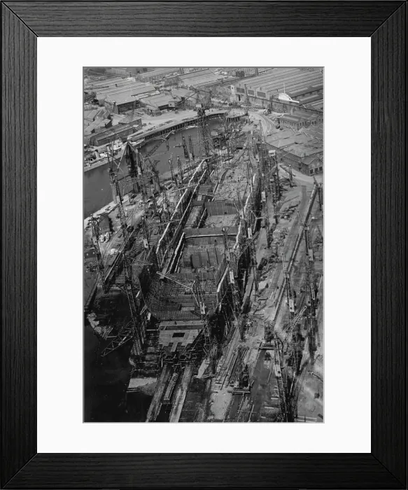 Framed Print : New Cunarder Takes Shape -- An aerial view of the '552' sister ship to the Queen Mary as it appeared over the week-end