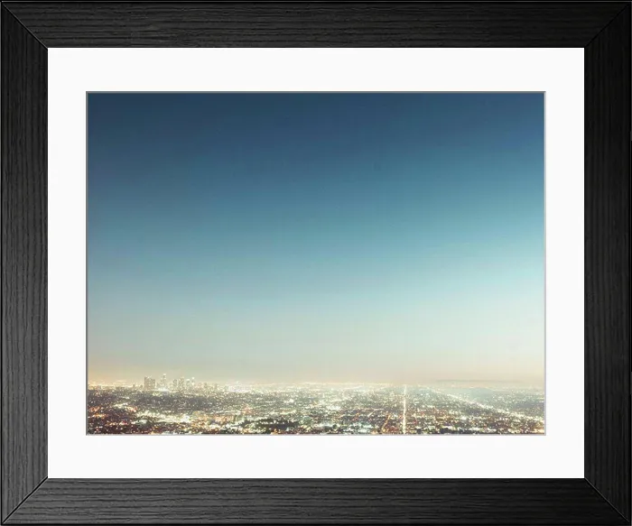 Framed Print : Aerial view of illuminated cityscape against blue sky, Los Angeles, California, USA Framed Print : Aerial view of illuminated cityscape against blue sky, Los Angeles, California, USA