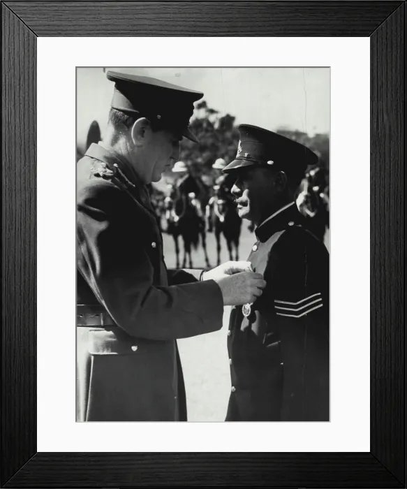 Framed Print : The governor lord Wakehard pinning king's police medal on breast of Sgt Tracker Alexander Relay Framed Print : The governor lord Wakehard pinning king's police medal on breast of Sgt Tracker Alexander Relay