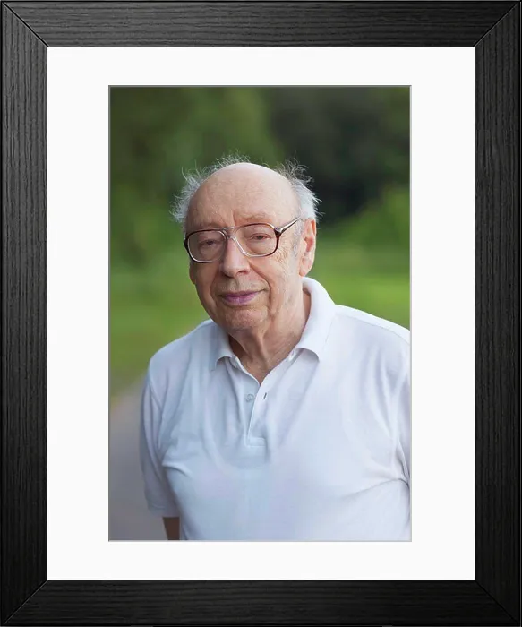 Framed Print : Portrait of smiling senior man standing at park Framed Print : Portrait of smiling senior man standing at park
