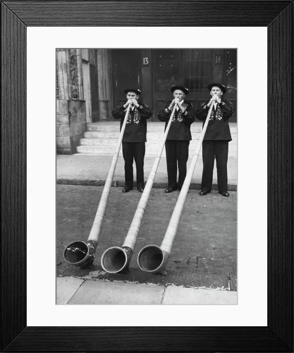 Framed Print : Blowing Their Own Trumpets! -- Swiss mountaineers demonstrating their skill on the 12 feet long wooden alp-horns Framed Print : Blowing Their Own Trumpets! -- Swiss mountaineers demonstrating their skill on the 12 feet long wooden alp-horns
