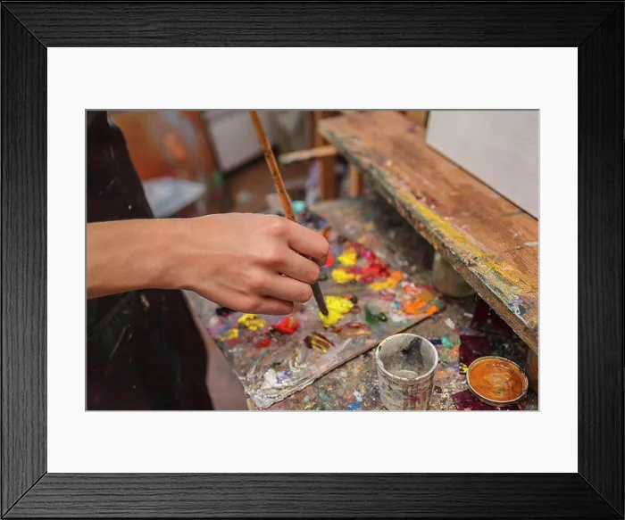 Framed Print : High angle view of artist mixing paint in palette at studio Framed Print : High angle view of artist mixing paint in palette at studio