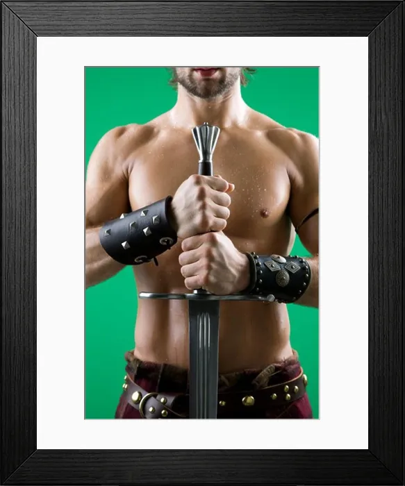 Framed Print : Young man in warrior costume holding a sword