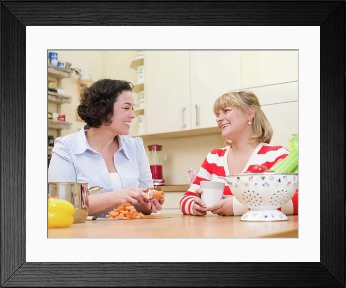 Framed Print : Two women cooking. Framed Print : Two women cooking.