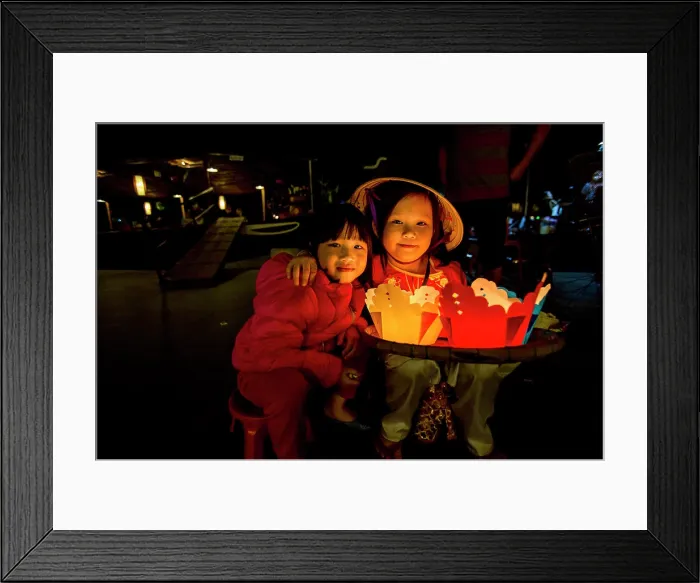 Framed Print : Girl selling candle floats. Tet Festival, New Year celebration, Vietnam. (MR) Framed Print : Girl selling candle floats. Tet Festival, New Year celebration, Vietnam. (MR)