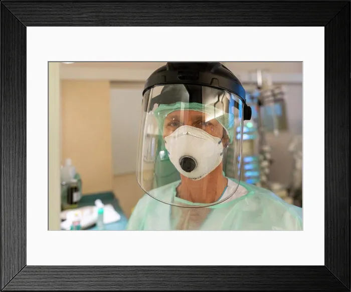 Framed Print : a nurse is in protective gear against covid-19 Framed Print : a nurse is in protective gear against covid-19