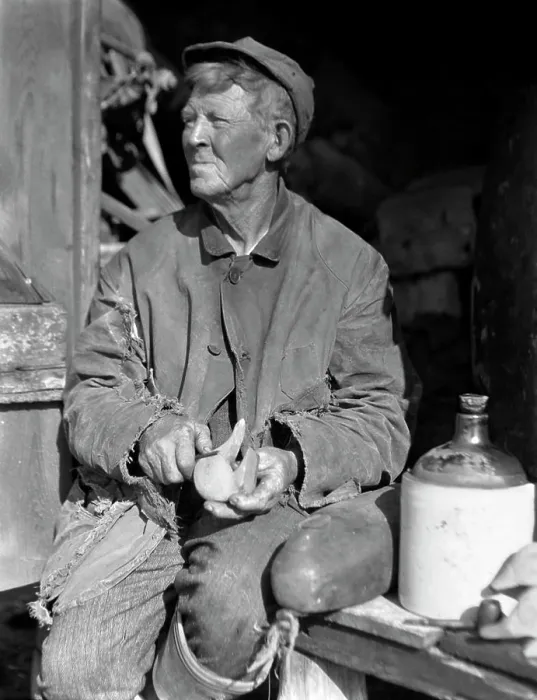 Framed Print : 1920S 1930S Elderly Man Weathered Face Sitting Beside Jug Carving Duck Decoy Framed Print : 1920S 1930S Elderly Man Weathered Face Sitting Beside Jug Carving Duck Decoy