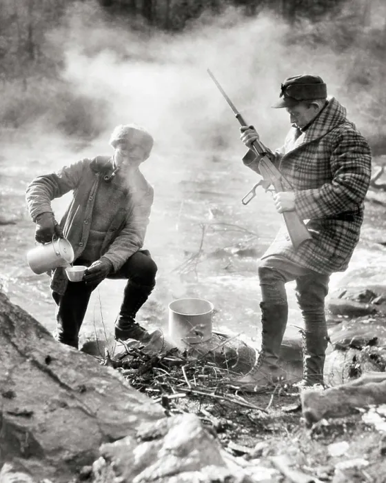 Framed Print : 1920s TWO HUNTERS STANDING CAMPED BY STREAM ONE MAKING COFFEE OVER CAMPFIRE ONE CHECKING LEVER ACTION RIFLE NEW Framed Print : 1920s TWO HUNTERS STANDING CAMPED BY STREAM ONE MAKING COFFEE OVER CAMPFIRE ONE CHECKING LEVER ACTION RIFLE NEW