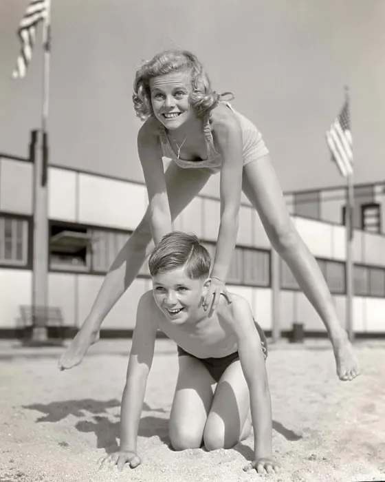 Framed Print : 1930s 1940s SMILING GIRL AND BOY PLAYING LEAP FROG ON SAND BEACH BROTHER KNEELING BLONDE SISTER JUMPING OVER HIS BACK Framed Print : 1930s 1940s SMILING GIRL AND BOY PLAYING LEAP FROG ON SAND BEACH BROTHER KNEELING BLONDE SISTER JUMPING OVER HIS BACK
