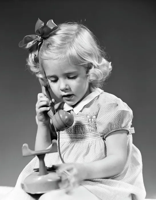 Framed Print : 1940S Little Blond Girl Talking On Toy Telephone Framed Print : 1940S Little Blond Girl Talking On Toy Telephone