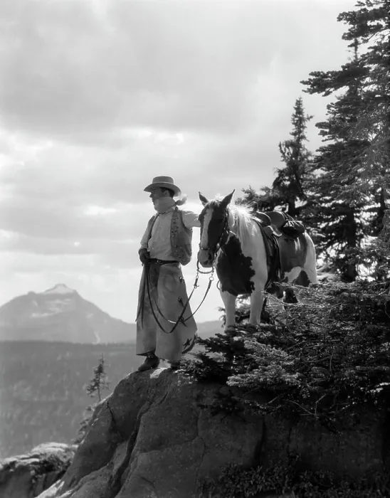 Framed Print : 1940S Man Cowboy In Chaps Vest Hat And Kerchief With Palomino Horse On Peak Overlooking Glacier Park Montana Usa Framed Print : 1940S Man Cowboy In Chaps Vest Hat And Kerchief With Palomino Horse On Peak Overlooking Glacier Park Montana Usa