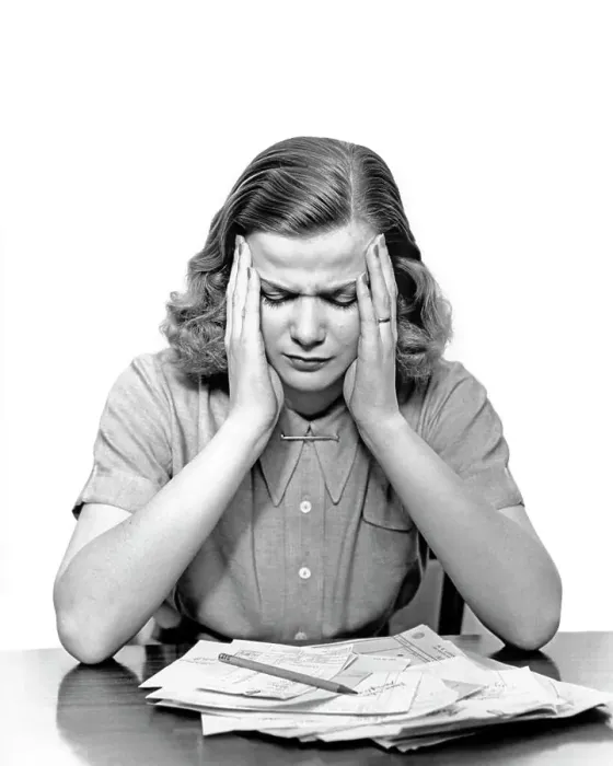 Framed Print : 1940s PANIC STRICKEN OVERWHELMED WOMAN HOLDING HER HEAD LOOKING DOWN AT PILE OF UNPAID BILLS ON THE TABLE Framed Print : 1940s PANIC STRICKEN OVERWHELMED WOMAN HOLDING HER HEAD LOOKING DOWN AT PILE OF UNPAID BILLS ON THE TABLE
