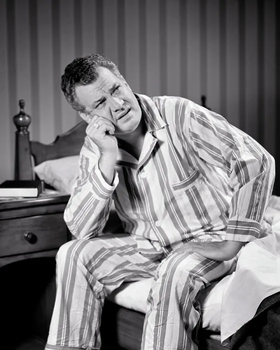 Framed Print : 1940s SLEEPLESS MATURE MAN WEARING STRIPED PAJAMAS SITTING ON EDGE OF BED WITH FRUSTRATED TIRED FACIAL EXPRESSION Framed Print : 1940s SLEEPLESS MATURE MAN WEARING STRIPED PAJAMAS SITTING ON EDGE OF BED WITH FRUSTRATED TIRED FACIAL EXPRESSION